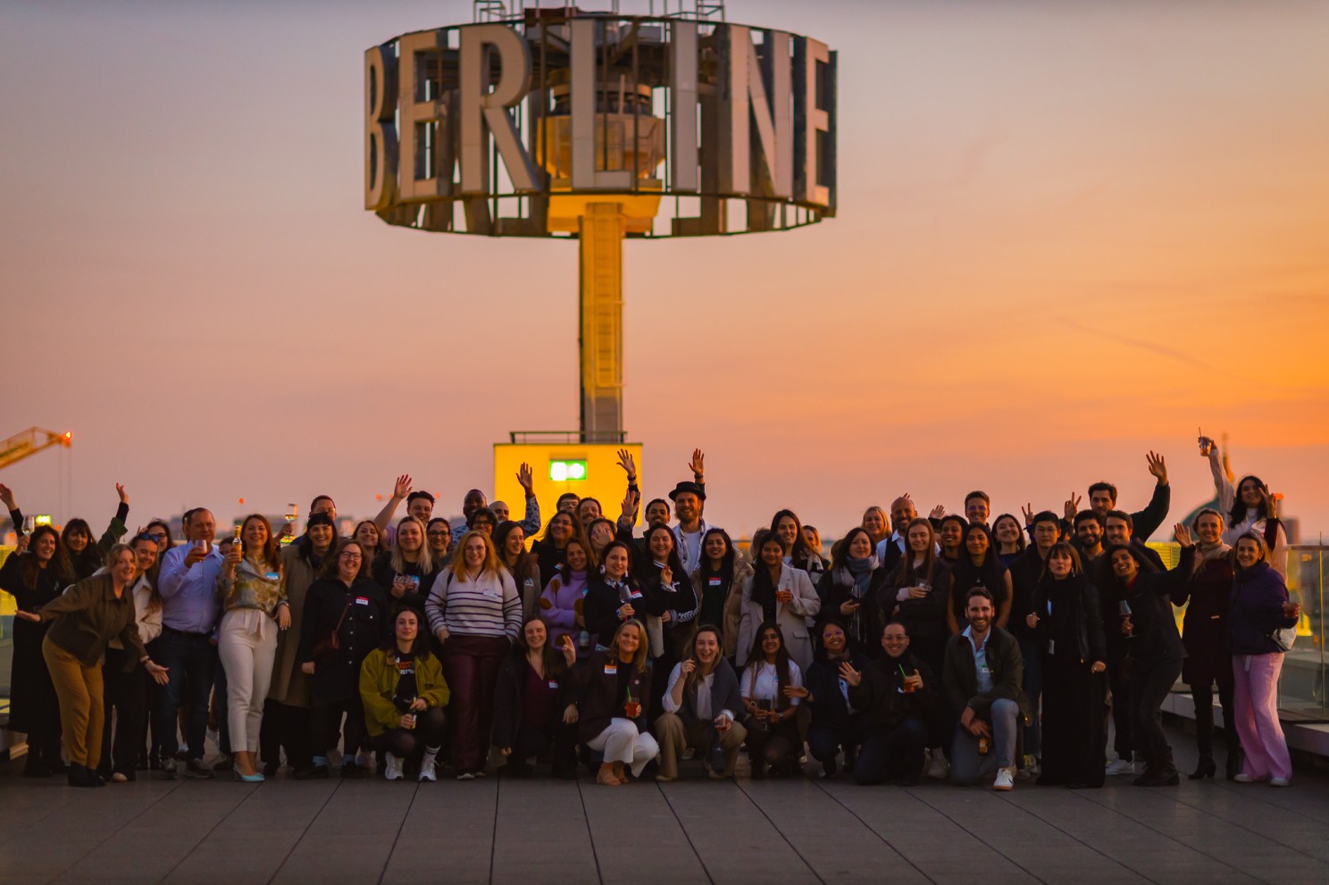 The Talent Crunch community group photo on a Berlin rooftop at sunset